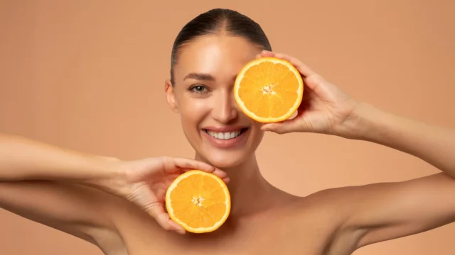 young-woman-orange-fruit-skincare-beauty-vitamin-c.webp.webp