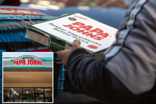 delivery-worker-carries-papa-johns-122687219.jpg