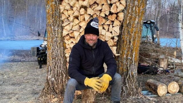 josh-duhamel-in-front-of-chopped-wood.jpg