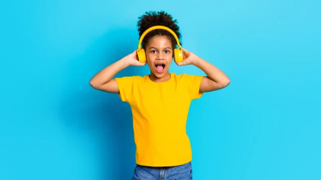 girl-yellow-headphones-t-shirt-jeans-close.webp.webp