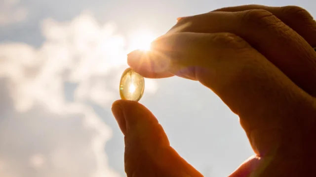 hand-holding-vitamin-d-pill-in-sunlight.webp.webp