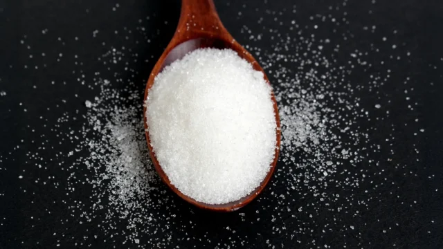 sugar-sweetener-spoon-black-background.webp.webp