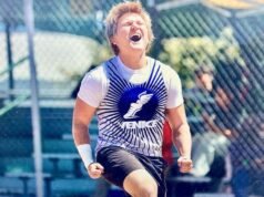 O arremessador de peso Lawrence Kensinger quebra o recorde do campeonato City de 43 anos